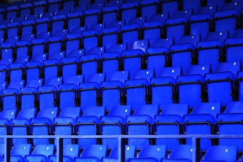 Repeating Rows of Blue Tip Up Sutton Stadium Seating by Restall Seating, Sold by WIllstack Furniture Co