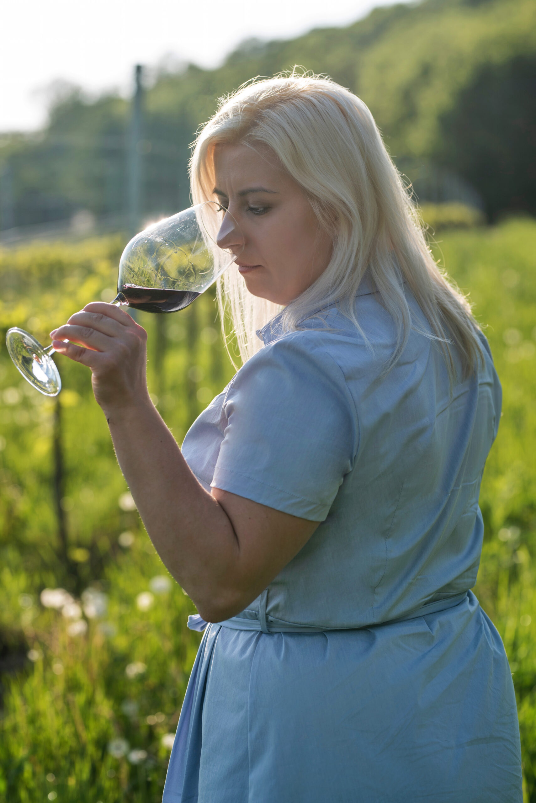 Wine writer tasting a red wine