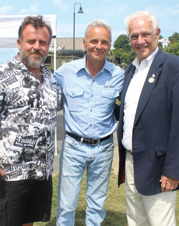 Veterans event organizers John Floyd and Captain Tim Gover, with Council President Peter Gill, at the Town Landing.