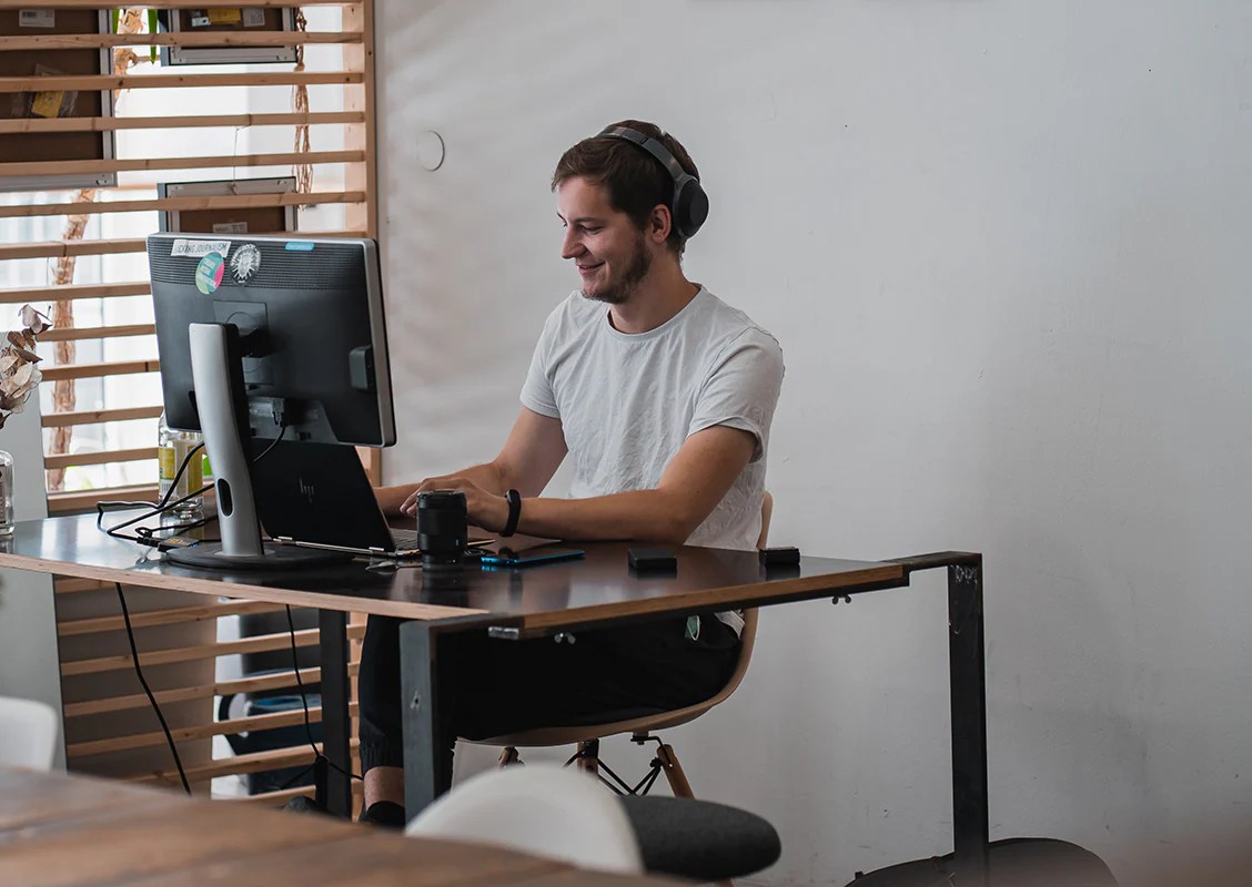 Person appearing slightly duplicated showing divided attention while trying to focus