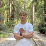 Sabina backpacking next to a stream