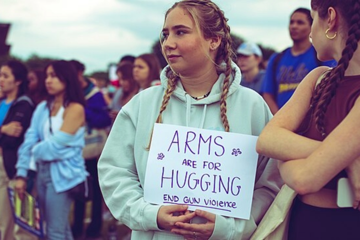 Young people protesting the shooting fields.