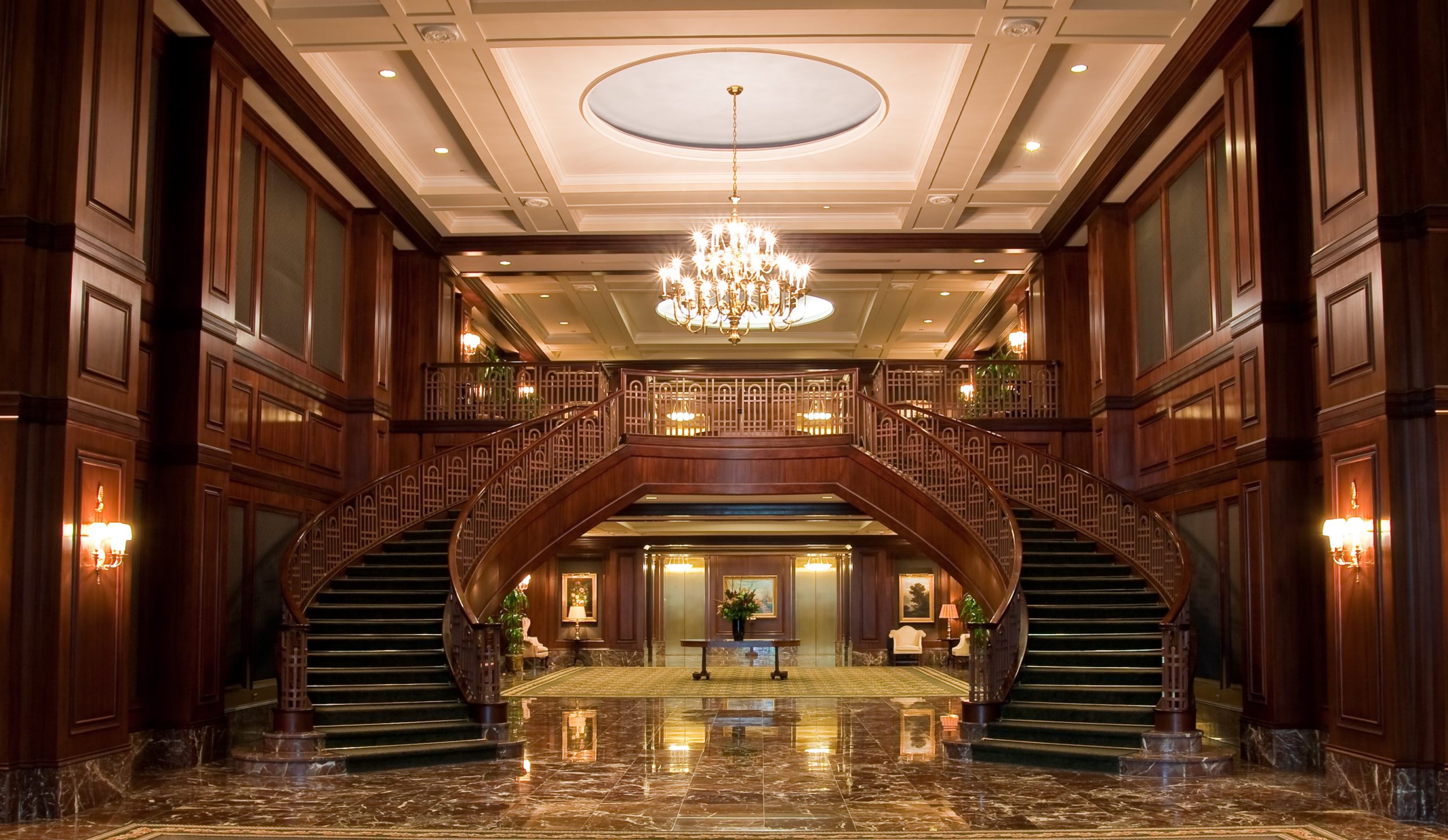 Carpet,Leading,To,Twin,Curving,Staircases,In,An,Office,Lobby