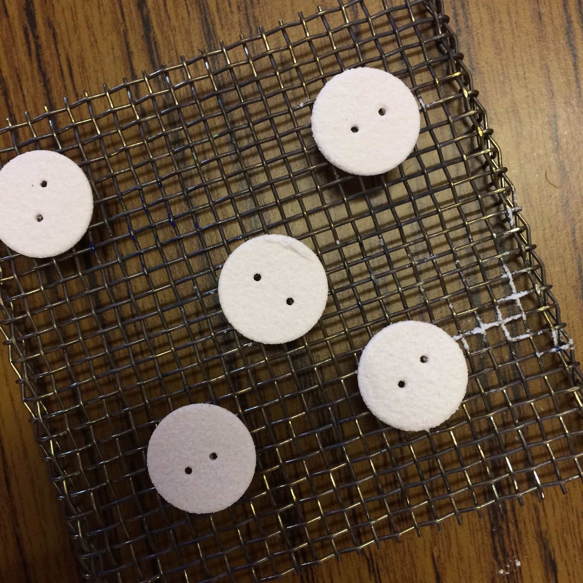 I struggled to keep my hand steady to lift the buttons onto the stilt, to go in the kiln