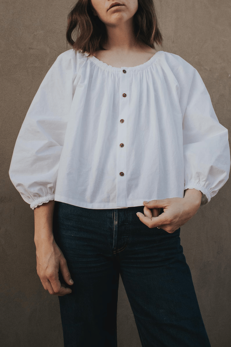 a woman wearing a ¾ sleeve white button down blouse sewing pattern