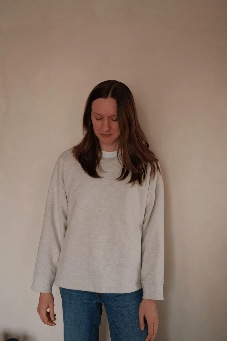 a woman wearing a relaxed lounge top sewing pattern