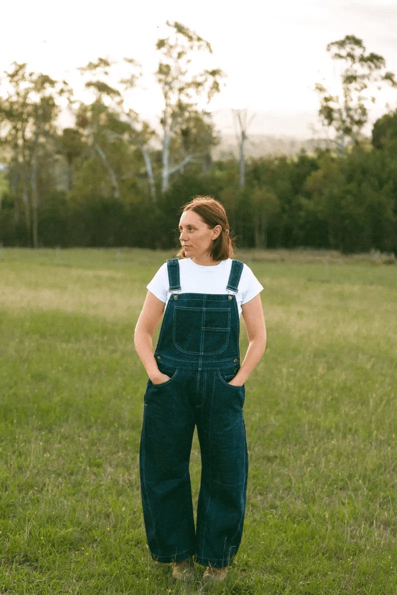 a woman wearing a pair of overalls sewing pattern