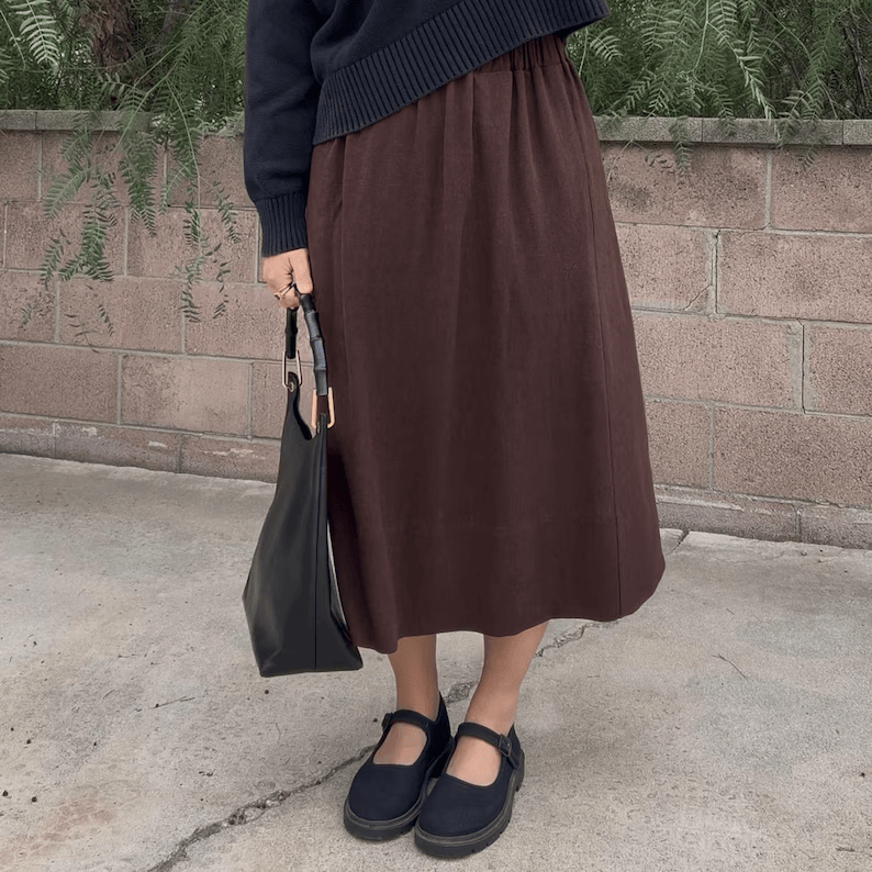 a woman wearing a brown handmade skirt sewing pattern