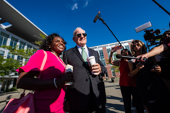 Lindsay Clancy's defense attorney Kevin Reddington takes a photo with a supporter outside the Plymouth County Superior Court in Plymouth, Massachusetts, on August 26, 2026. Lindsay Clancy is on trial for the January 2023 strangulation deaths of her three young children.