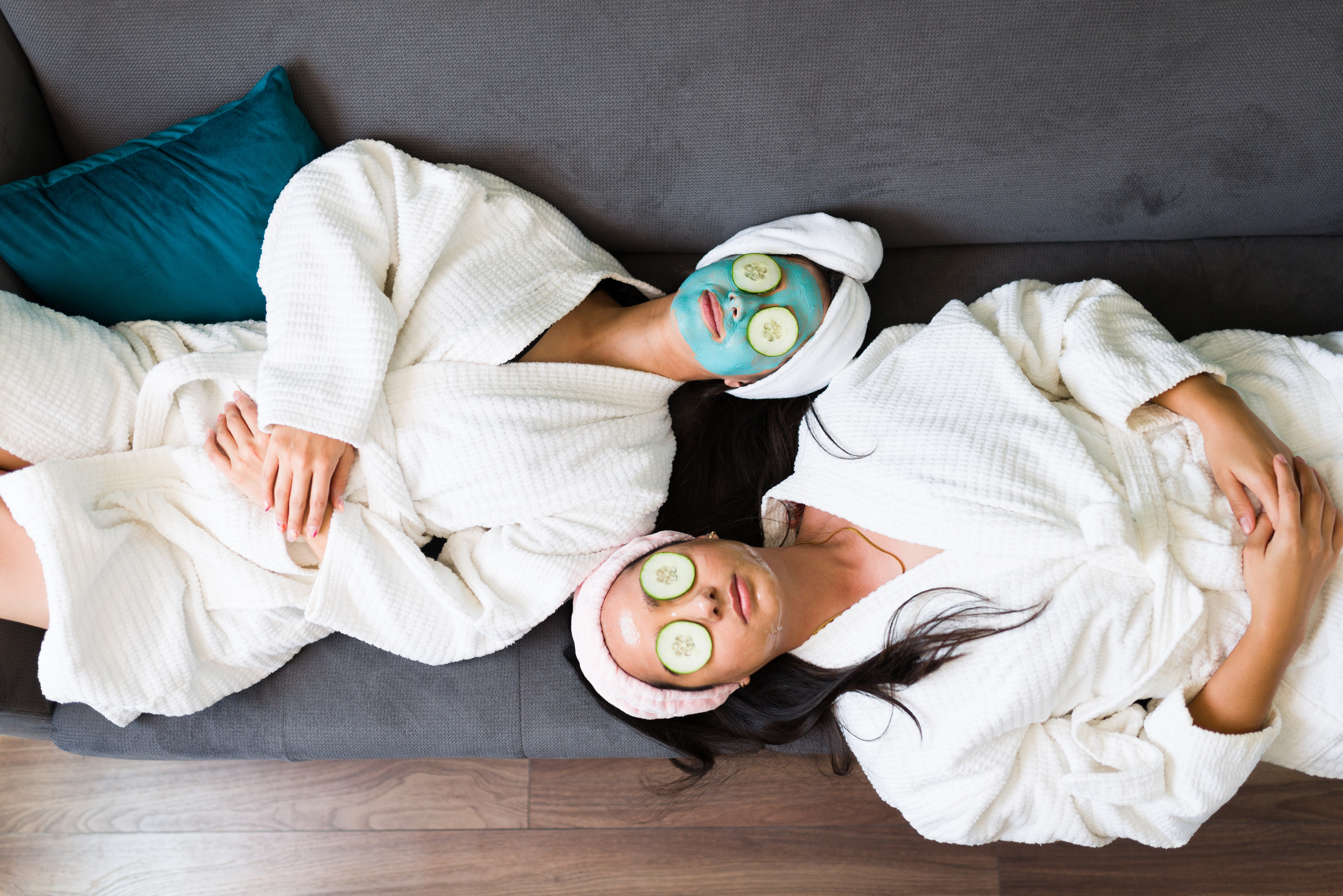 Rest like a pro! Importance of rest days. Two young healthy ladies enjoying a face mask at the spa.