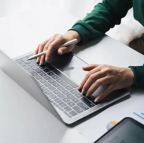 close up businesswoman working online on the white table at offi