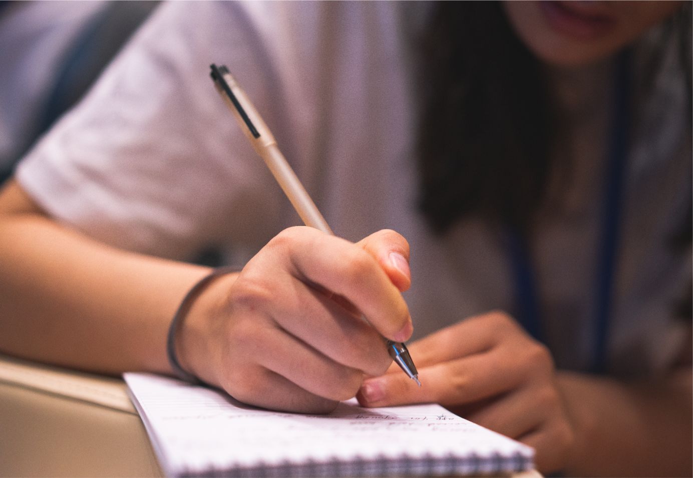 Girl writing on a note book