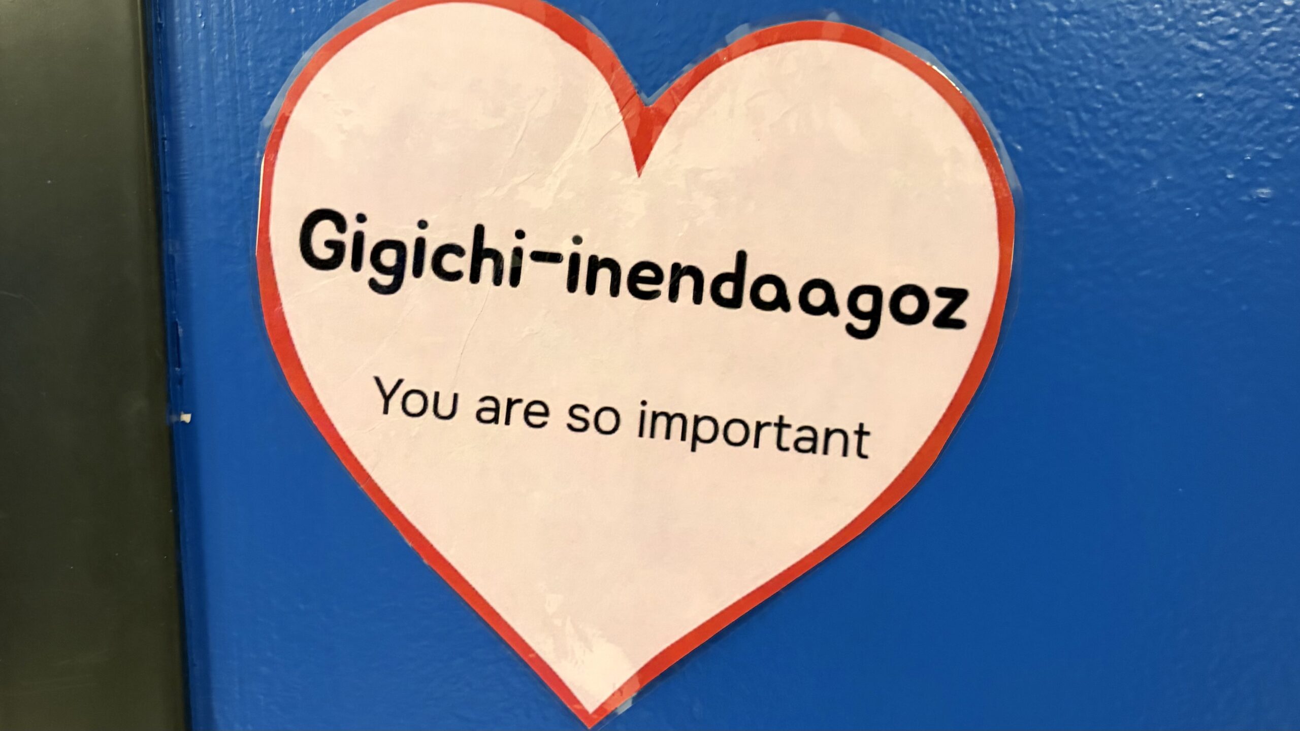 A school locker with an Ojibwi phrase in a school in Grand Marais