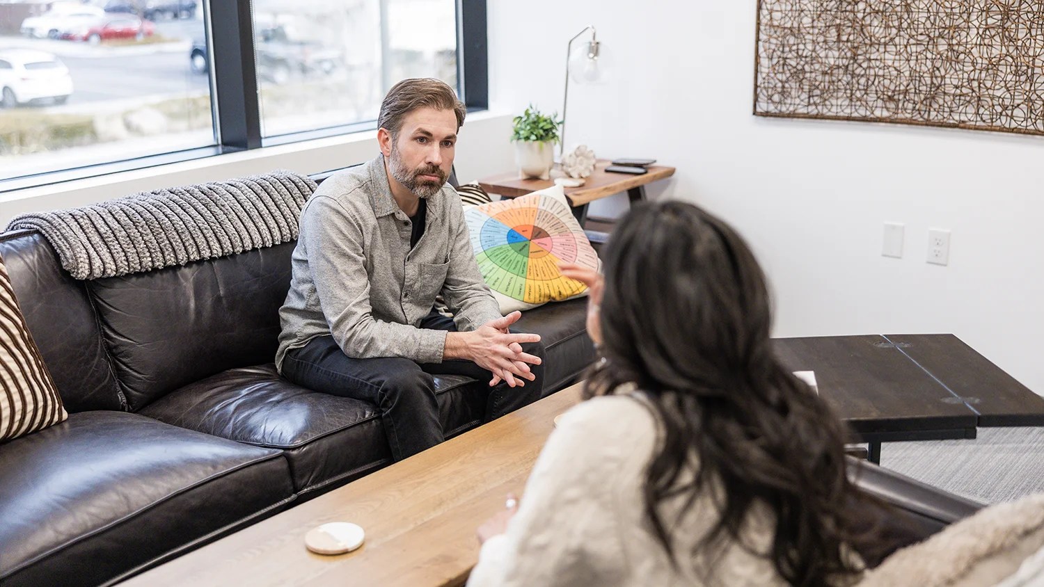 A man meets with his therapist