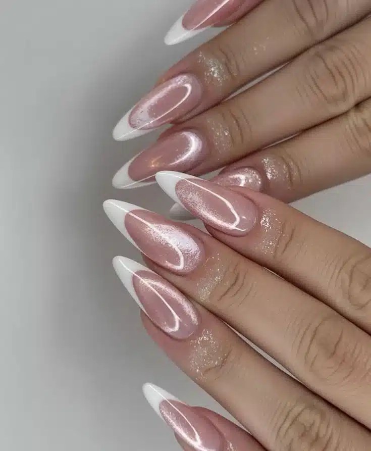 Chrome French manicure featuring pointed almond nail shape