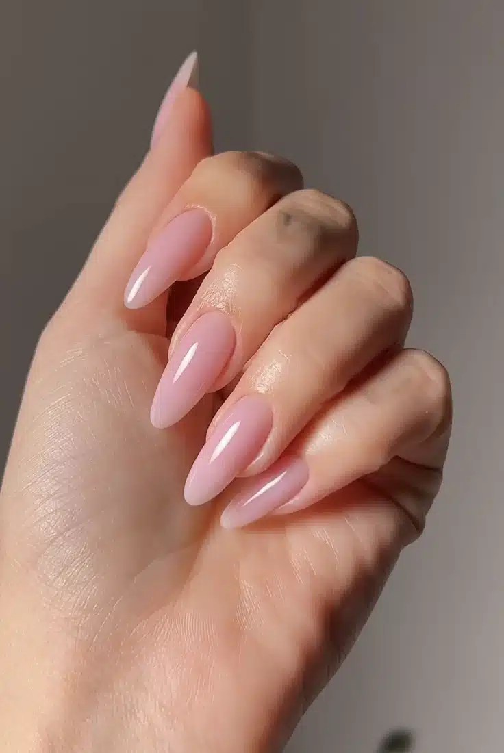 Soft pink almond-shaped manicure for graduation day