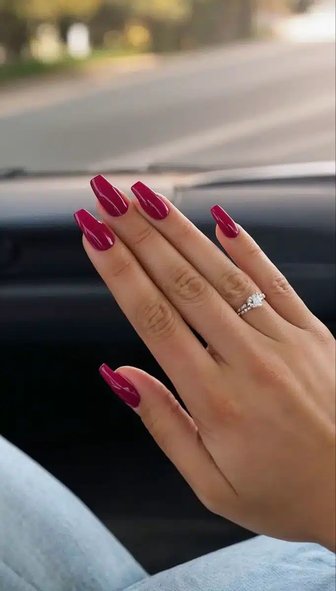Raspberry pink coffin-shaped nails with glossy finish