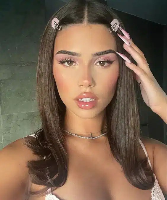 Pool day hairstyle featuring decorative hair clips that keep hair neatly styled while adding a fashionable finishing touch for summer holidays and beach days.