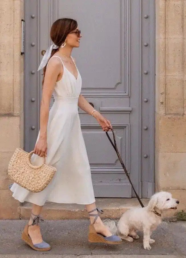 Summer outfit featuring raffia wedge sandals styled with matching raffia accessories, creating a coordinated European summer look perfect for holidays and warm-weather dressing.