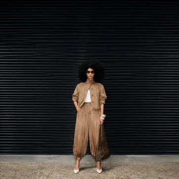 Model wearing a neutral suede co-ord from the M&S London Fashion Week Collection, featuring relaxed tailoring, oversized proportions and elevated accessories.