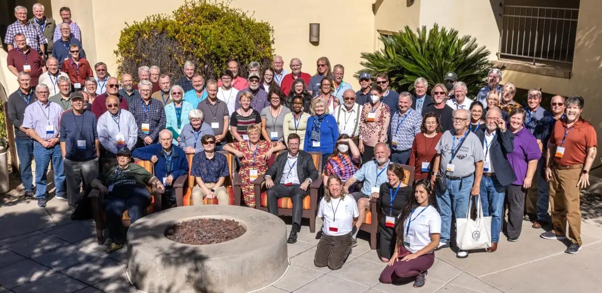 Group of people wearing badges and lanyards