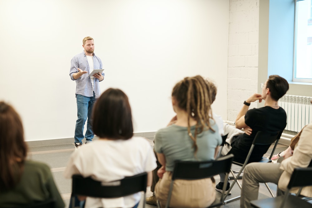 Man Speaking In Front Of A Class