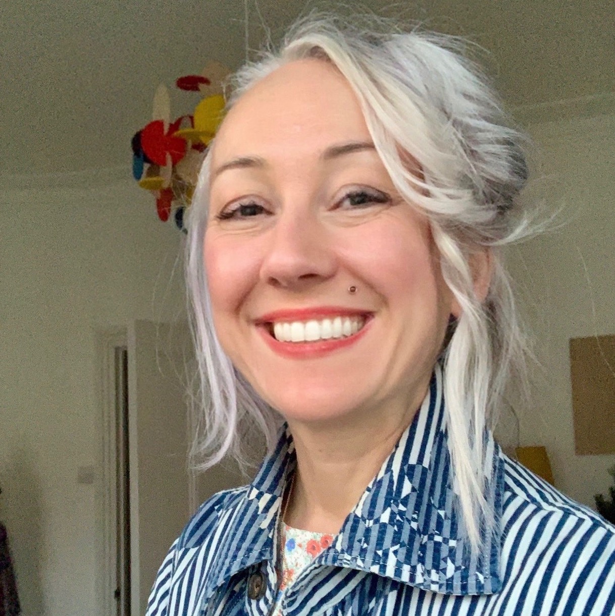 Photograph of Anouchka Grose, smiling.