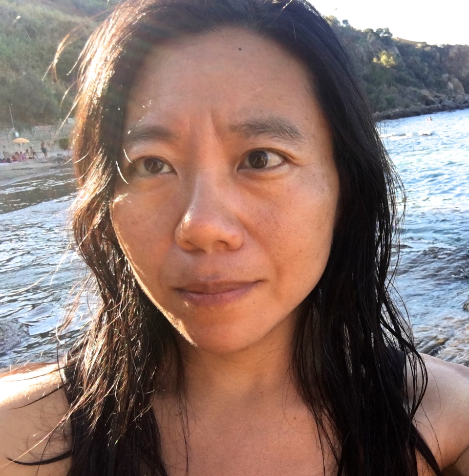 Photograph of Xiaolu Guo out at sea.