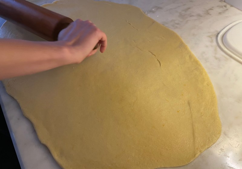 rolling out dough into a rectangle