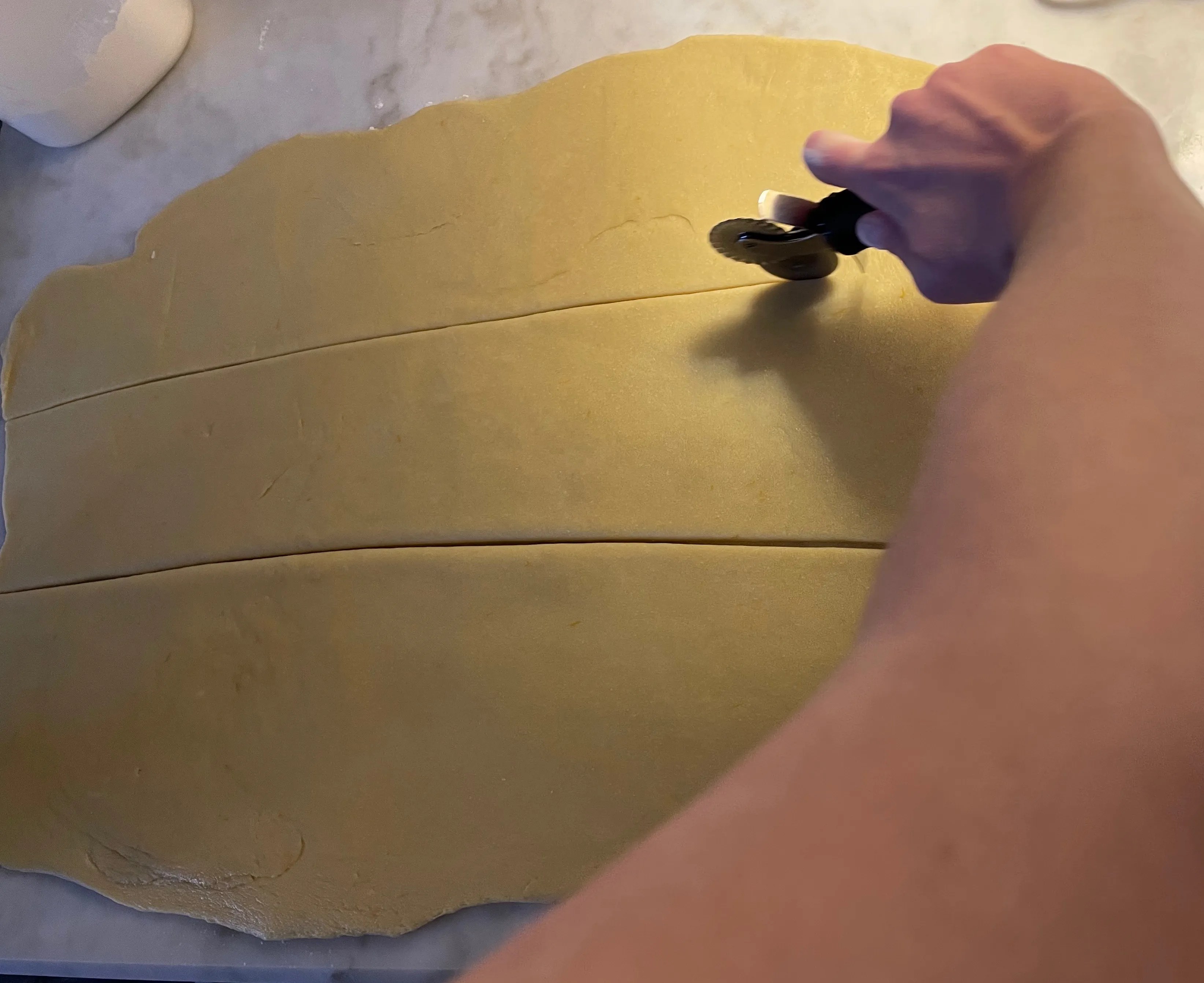 cutting dough into thirds