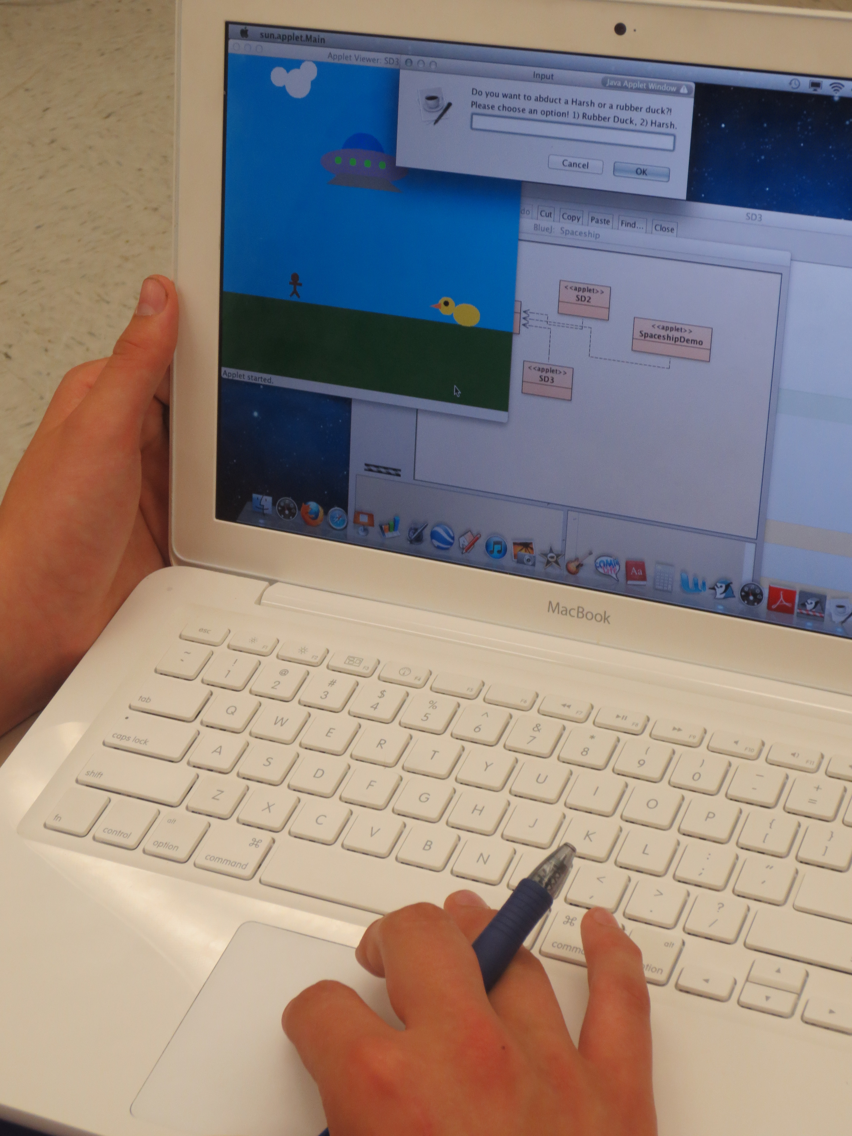 A student at Southeast High School shows his final project for a computer programming class