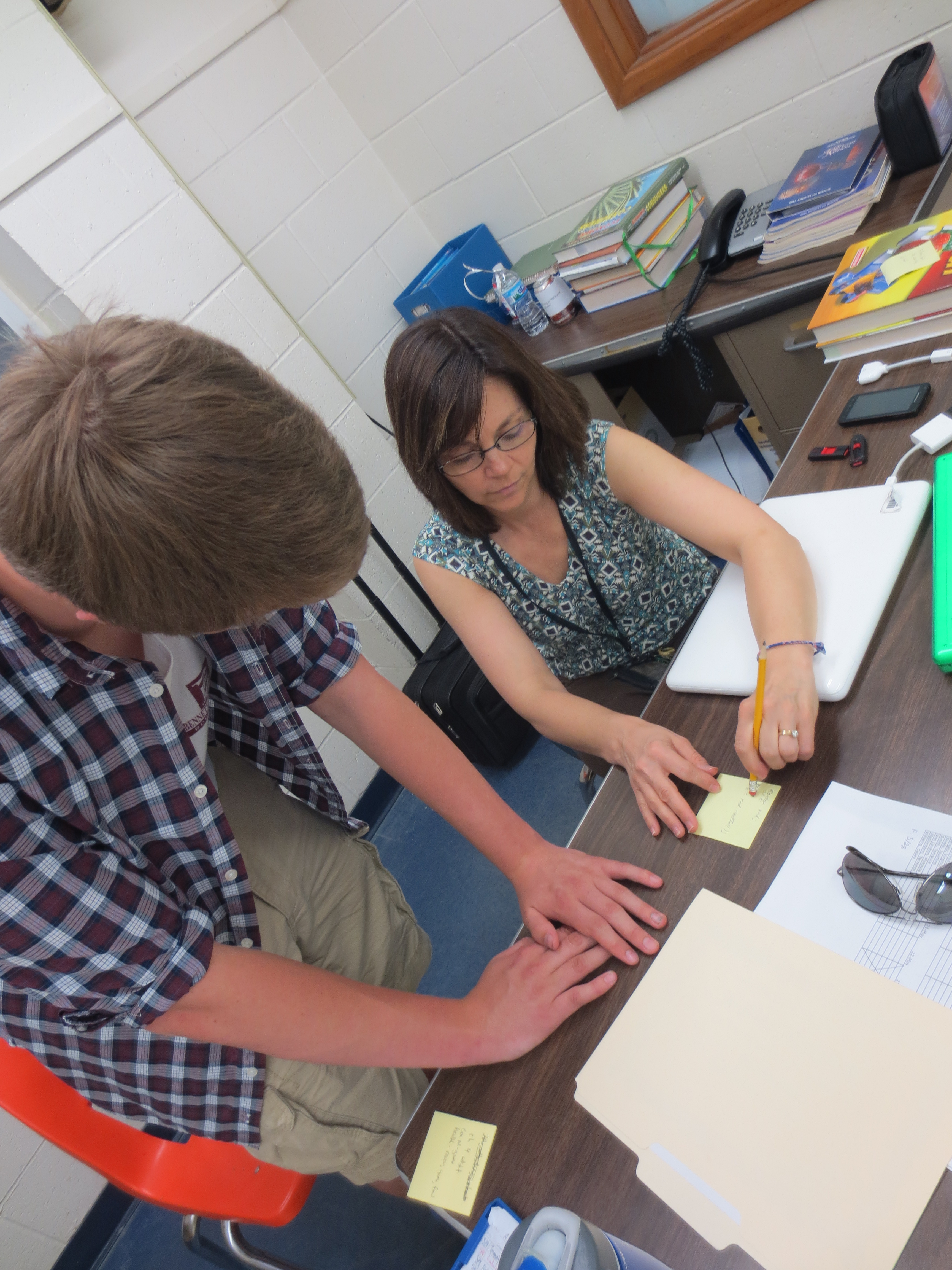 Jodi Patton helps a student at Southeast High School