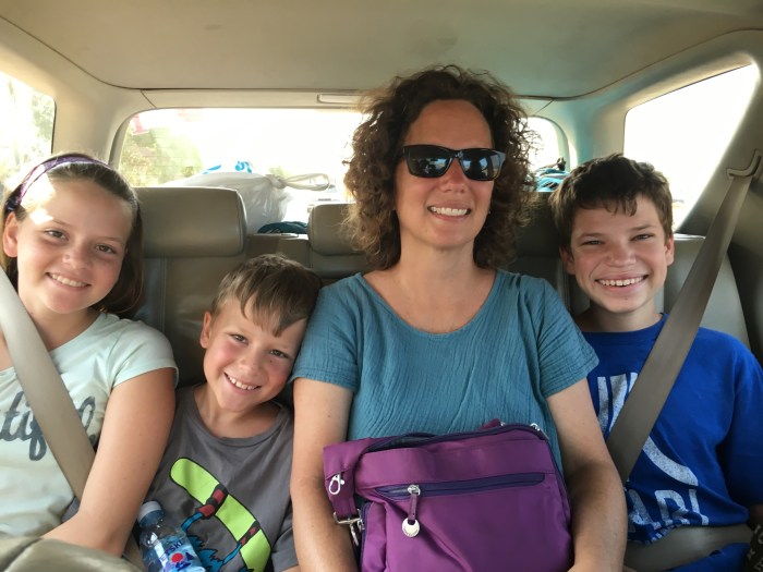 Squeezing into a taxi car for the 3 hour trip to the Thai border. Now that's family togetherness! 