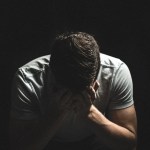 Man with head down cannot forgive himself