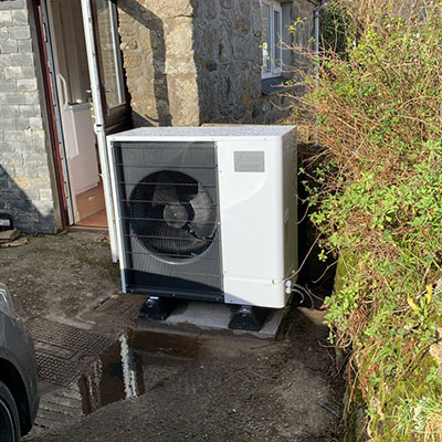 Air source heat pump outside the home