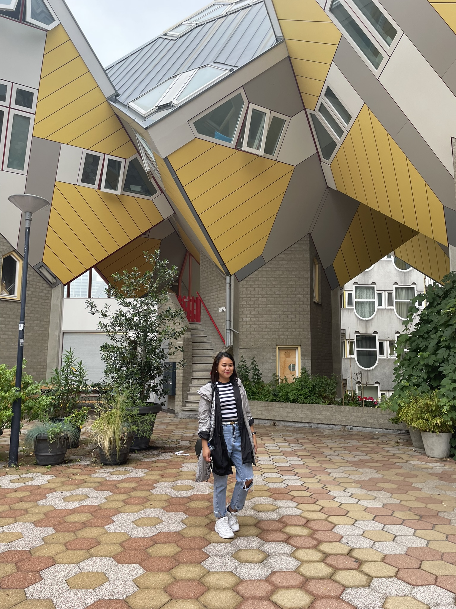 Picture of a woman standing outside the box