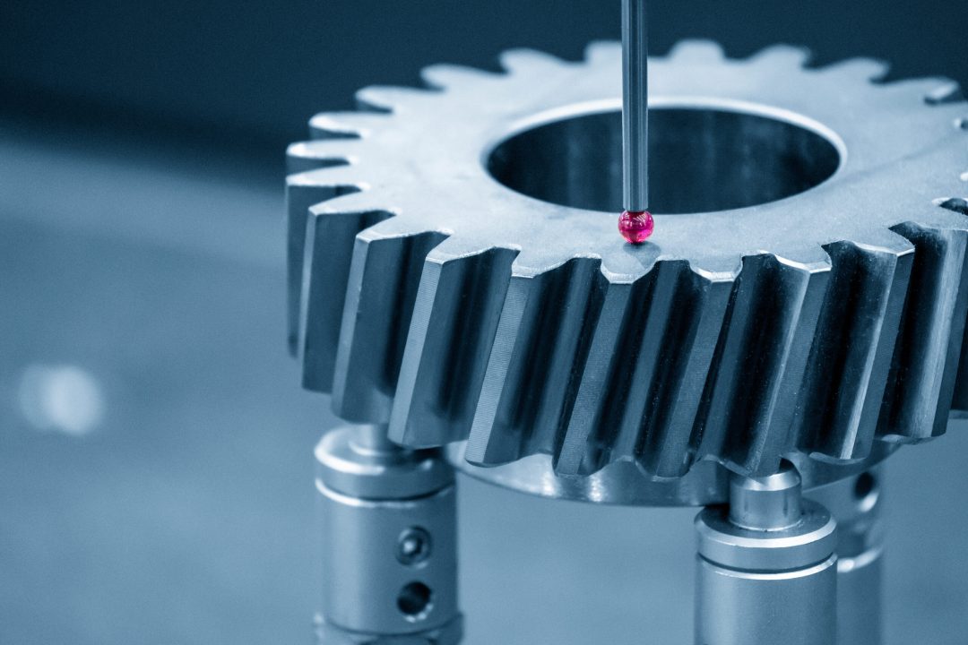 The CMM machine checking the dimension the bevel gear part . T Precision milled gear being inspected