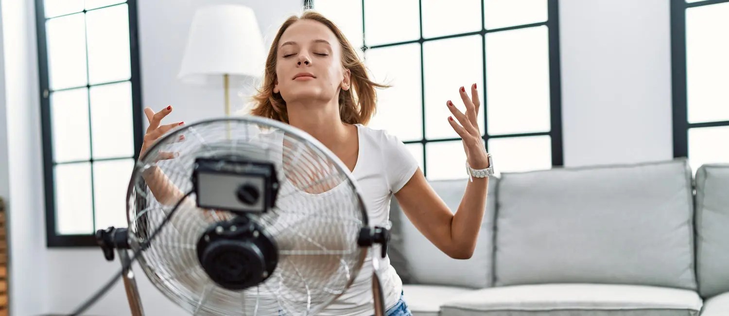 Does putting a fan in front of an air conditioner help?