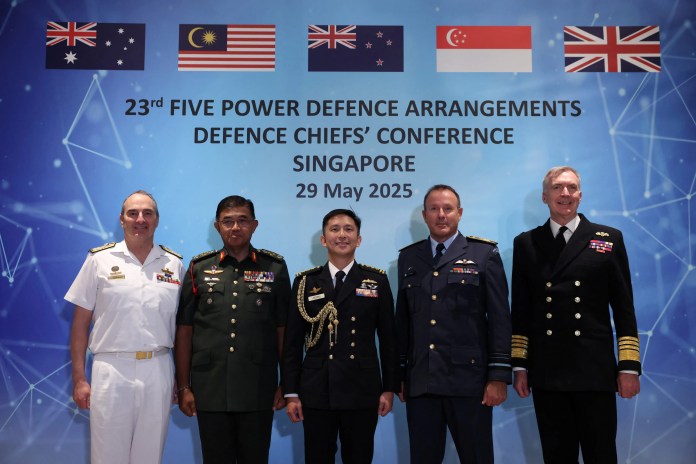 Singapore’s Chief of Defence Force Vice Admiral Aaron Beng, Australia’s Chief of Defence Force Admiral David Johnston, Malaysia’s Chief of Defence Force General Mohd Nizam Jaffar, New Zealand’s Chief of Defence Force Air Marshall Tony Davies, and UK Chief of the Defence Staff Admiral Tony Radakin pose at the Five Power Defence Arrangements (FPDA) Defence Chiefs’ Conference in Singapore, on May 29, 2025