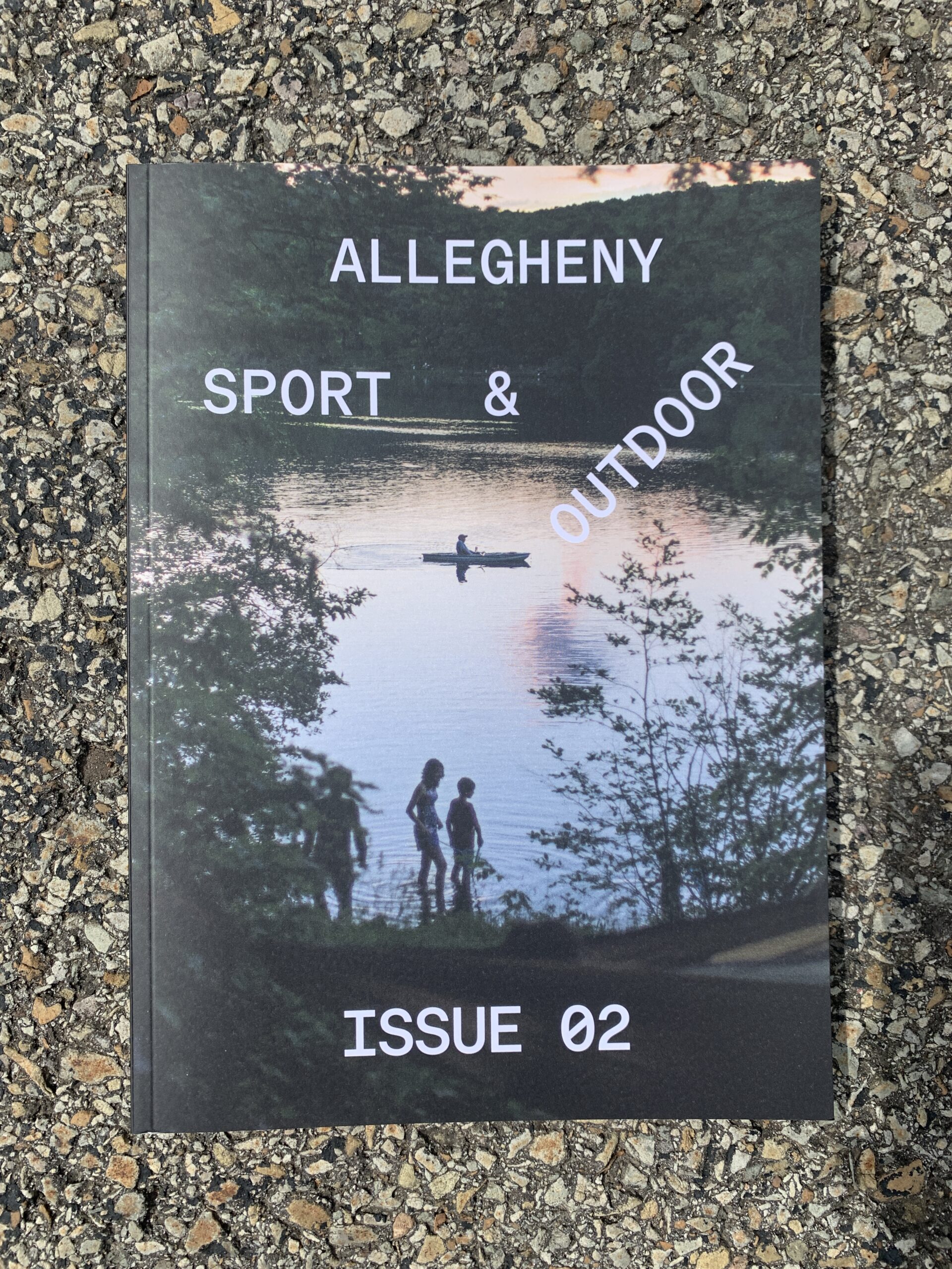 A magazine cover with a lake