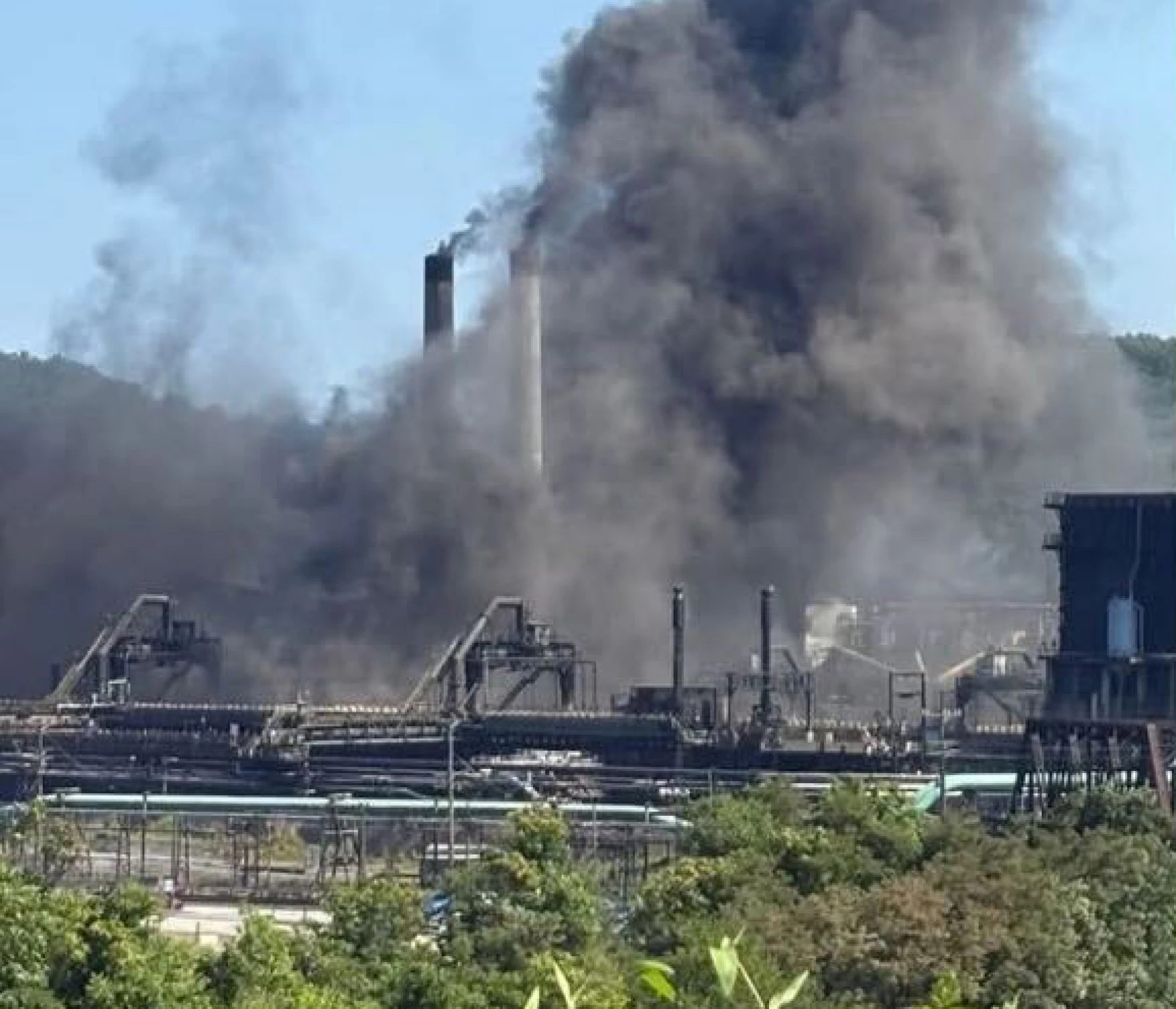 A plume of dark smoke and towers at the US Steel Clairton Coke Works