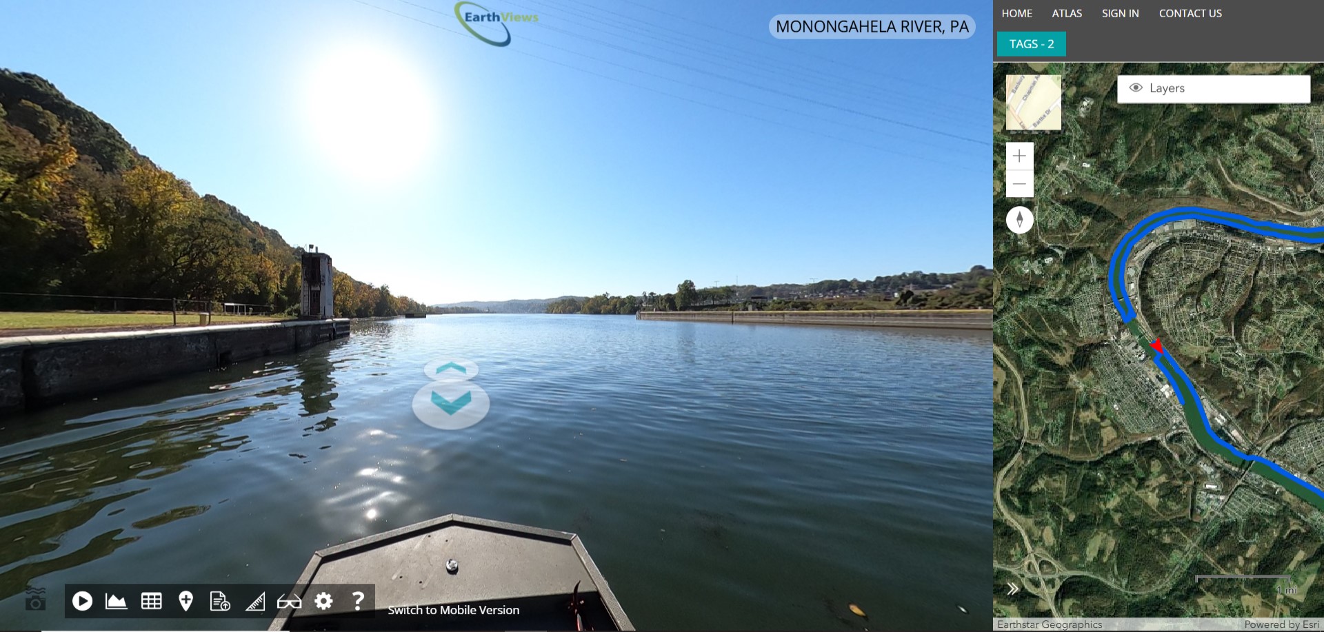 A sunny river and the tip of a boat