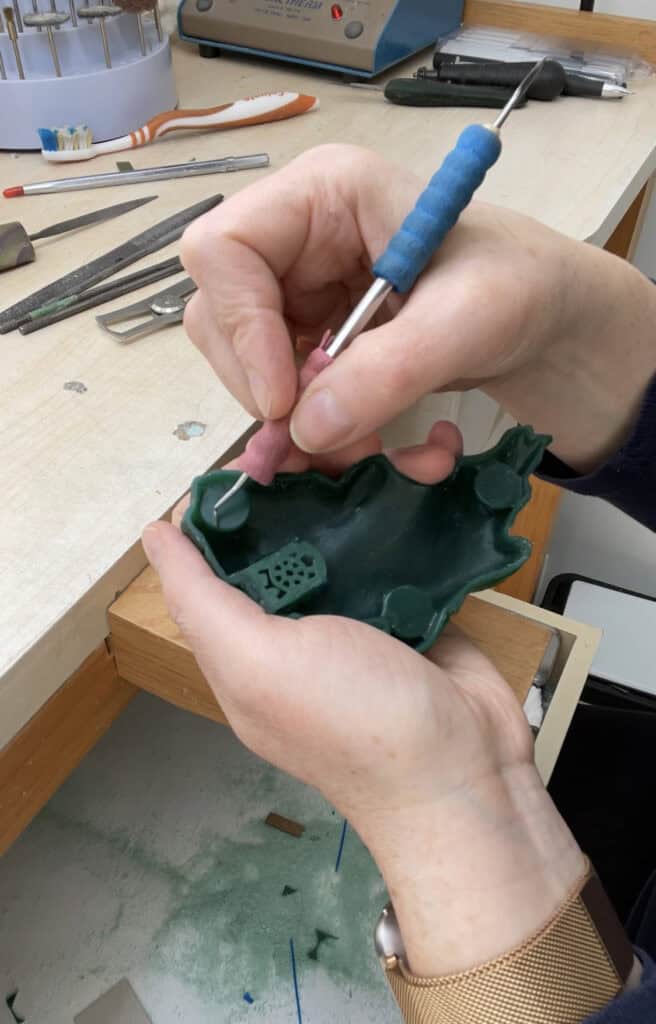 Carving wax at the jewellers bench