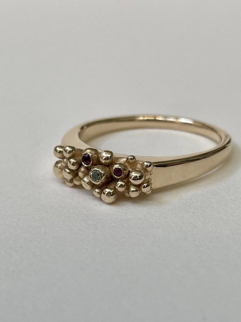 Gold Anemone Ring, saphire and two rubies