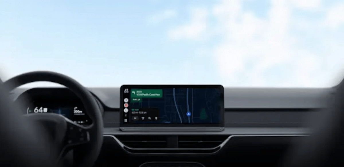 Android Auto dashboard display in a car showing Google Maps navigation and a live speedometer