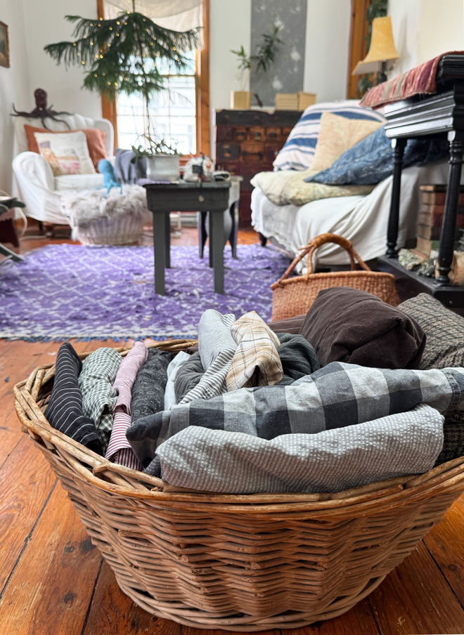 basket of laundered thrifted clothing for sewing - mostly menswear