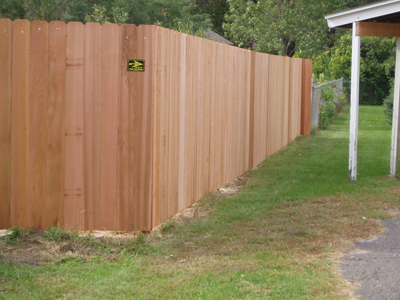 Cedar solid-board privacy fence installed by Arrow Fence Company