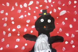 Child's painting of a penguin wearing a hat, surrounded by white snowflakes against a red background.