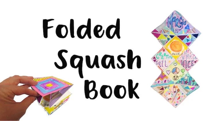 Hand holding a colorful, foldable squash book.