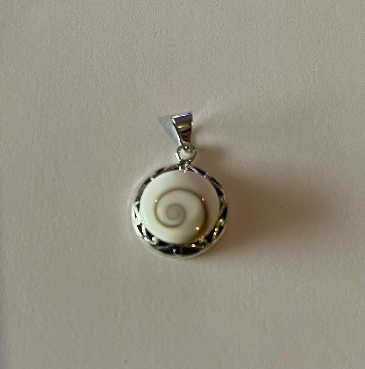 Round cochlear shaped with Black Oxidized Pendant